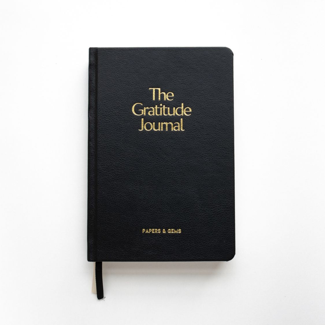 daily gratitude journal black on white desk